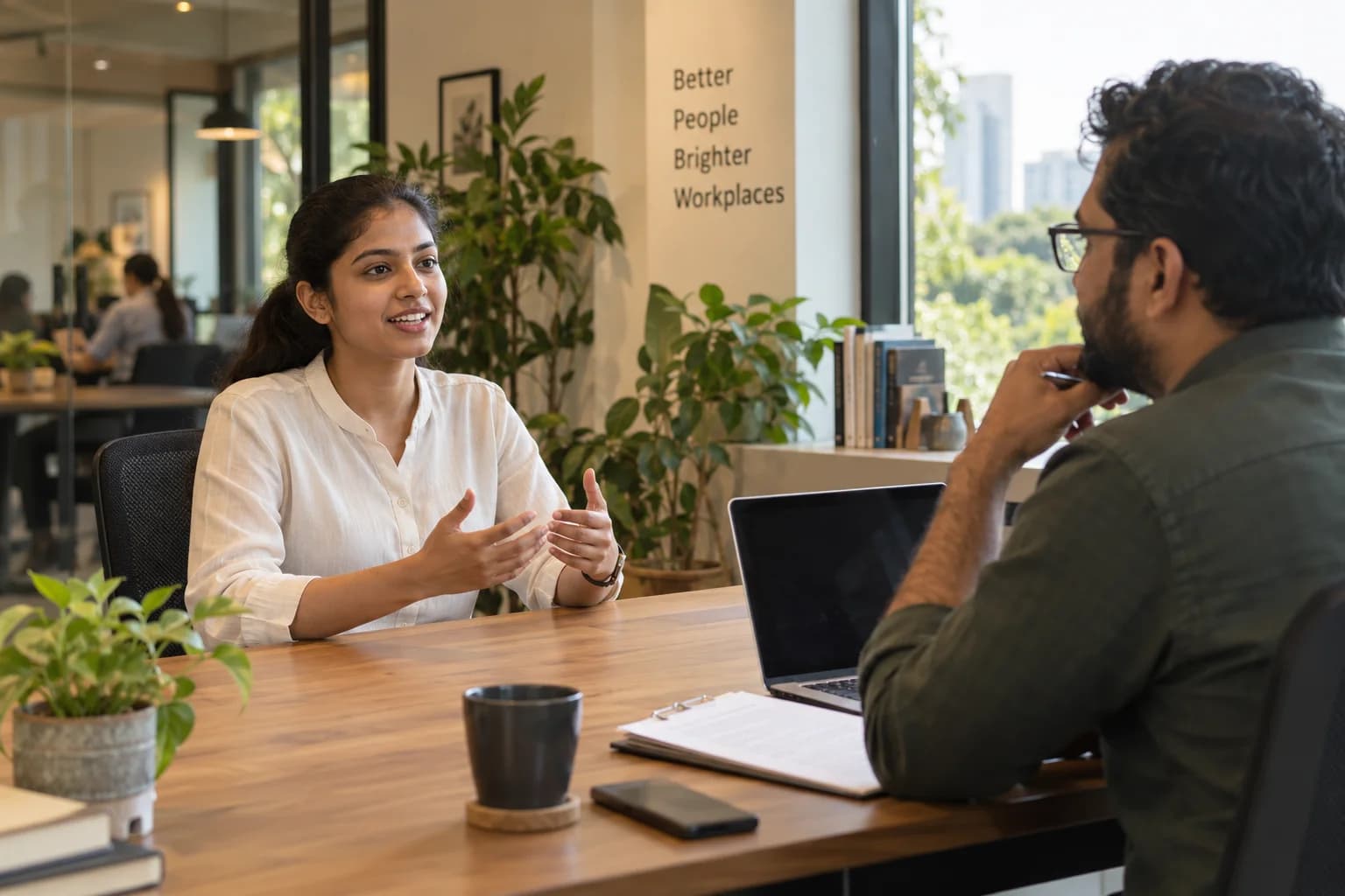 A job seeker practises answering questions in a one-to-one mock interview
