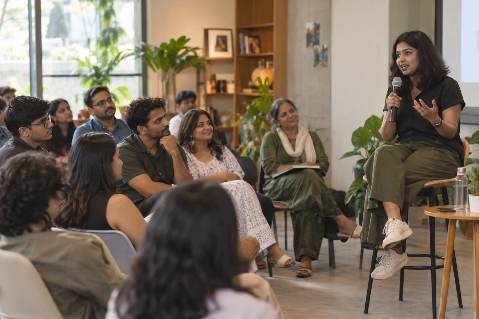 A guest speaker shares her professional experience with an attentive community audience.